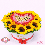 Caja con girasoles, rosas frescas y chocolates Ferrero para envío de flores y regalos a domicilio en Guadalajara, Zapopan y zona metropolitana.
