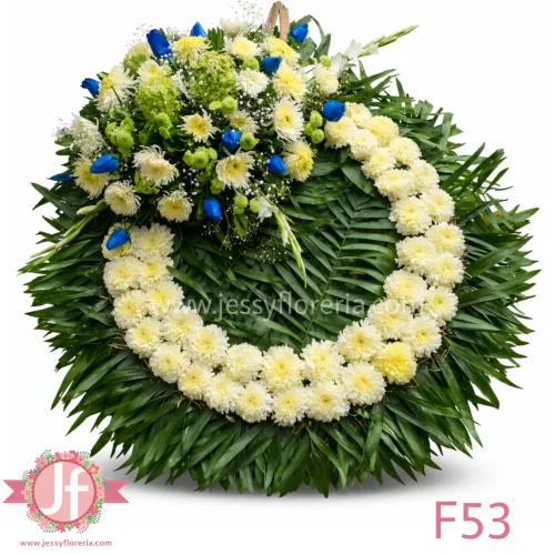 Corona fúnebre sencilla con rosas azules para envío a funerarias y velatorios en Guadalajara y zona metropolitana.