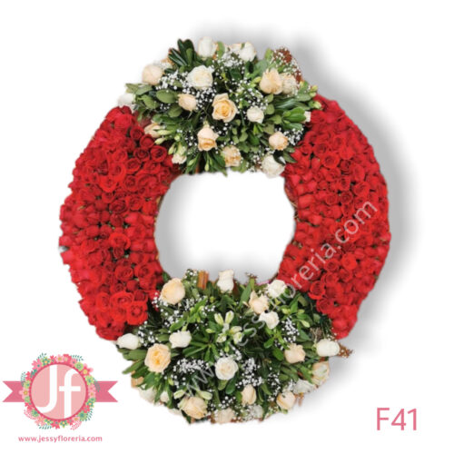 Corona fúnebre de rosas rojas y flor surtida