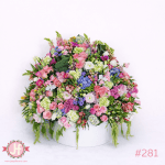 Caja circular grande vintage con flores frescas surtidas para envío de flores a domicilio en Guadalajara, Zapopan y zona metropolitana.