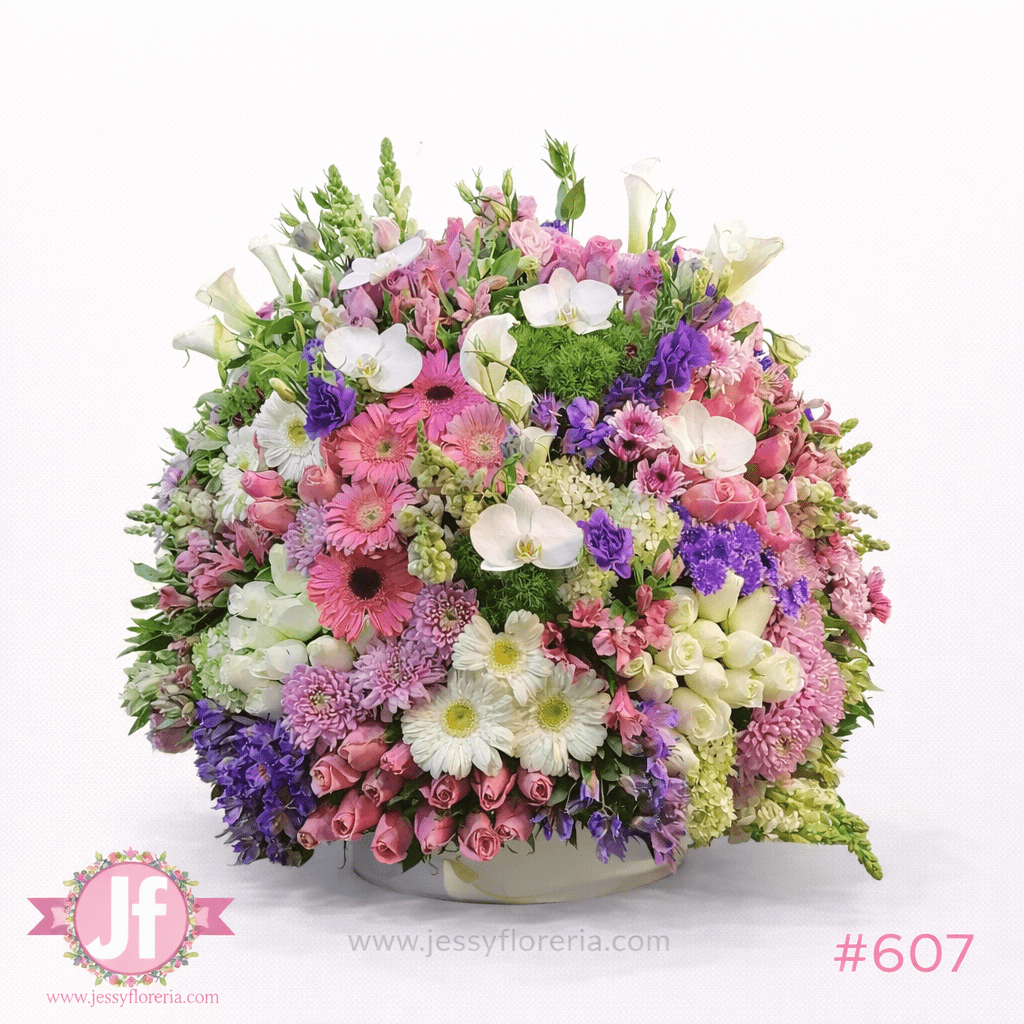 Caja circular vintage grande con rosas, gerberas, orquídeas y flores surtidas para envío de flores a domicilio en Guadalajara y zona metropolitana.